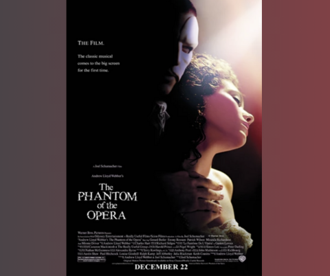 The Phantom of the Opera movie poster. There is a man with half a mask holding a woman from behind.