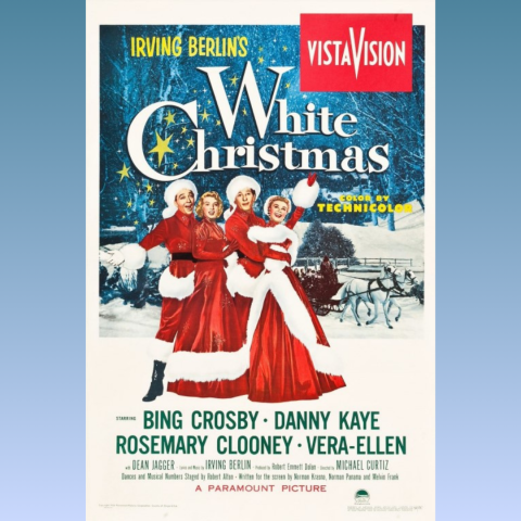 White Christmas actors with a snowy scene behind them