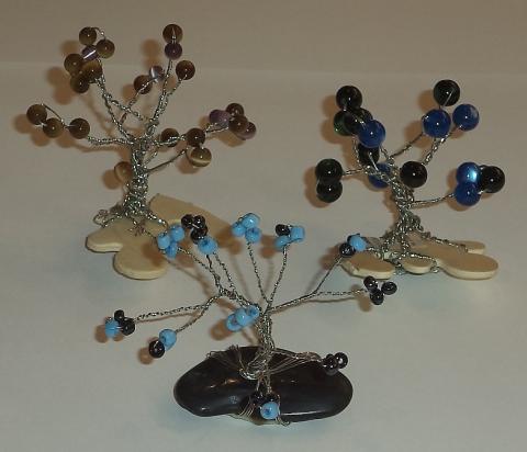 Trees made from wire, beads and gemstones.