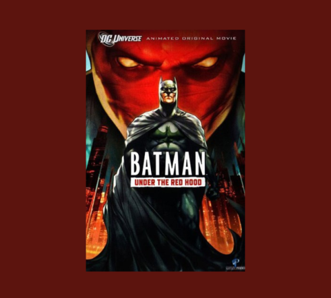 Movie poster for "Batman: Under the Red Hood" with an image of Batman in front of Gotham City and a red face with orange eyes looking down at him.