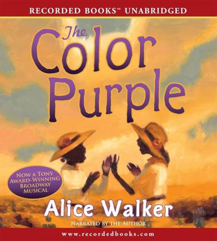 The cover of The Color Purple book with two African American women facing each other talking. Both are wearing white dresses and hats with flowers.