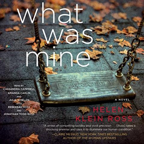 Cover for "What Was Mine" by Helen Klein Ross. The background shows a single empty swing seat hanging from rusty chains above fallen autumn leaves. The title text in large white letters reads: “what was mine.” Below, in smaller text, it says “A Novel.” The author’s name, Helen Klein Ross, is in pink.