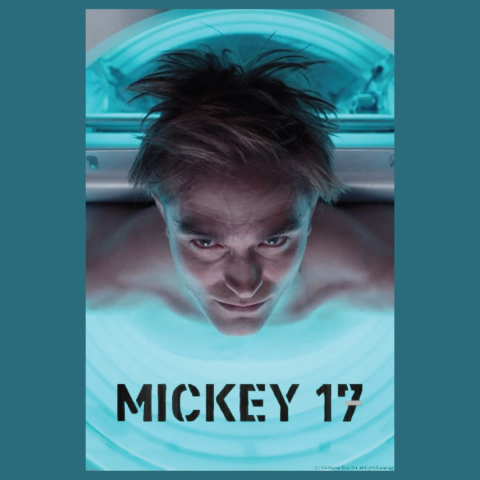 A person lies inside a glowing, futuristic chamber lit with bright blue light. Their face is centered and looking downward, with tousled hair spreading out above their head. Below the chamber, bold stencil-style text reads “MICKEY 17.”