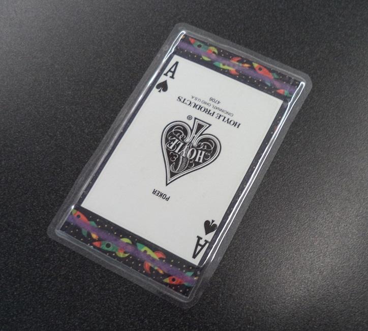 Image of a homemade bookmark with the ace of spades with rocket ships bordering it.